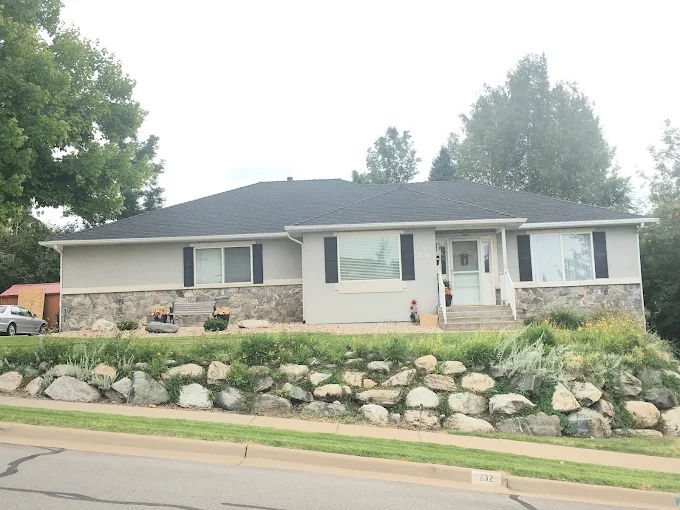 Roofing crew actively working on an emergency roof repair on a Utah home