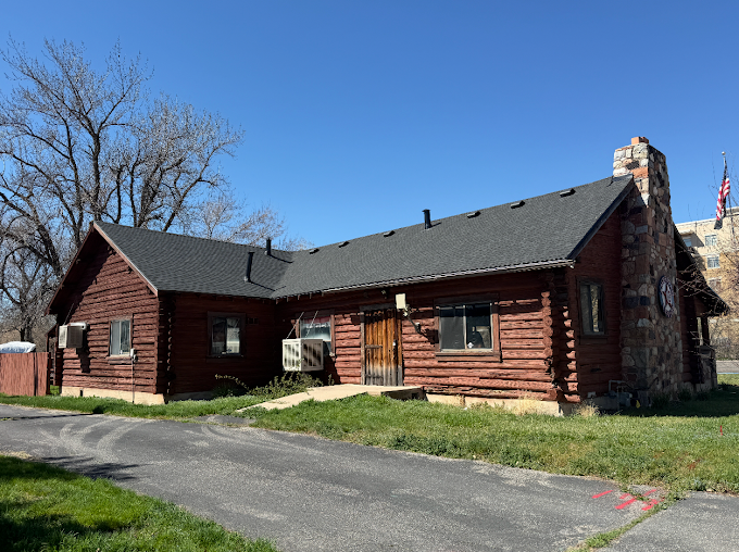 Completed insurance claim roof replacement on a log cabin home in Utah