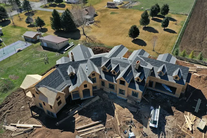 Aerial view of large luxury new construction roofing project in Utah